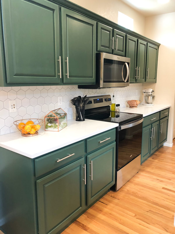 Updated kitchen. green cabinets with gold hardware. new, white, hexagon backsplash. clean and bright.